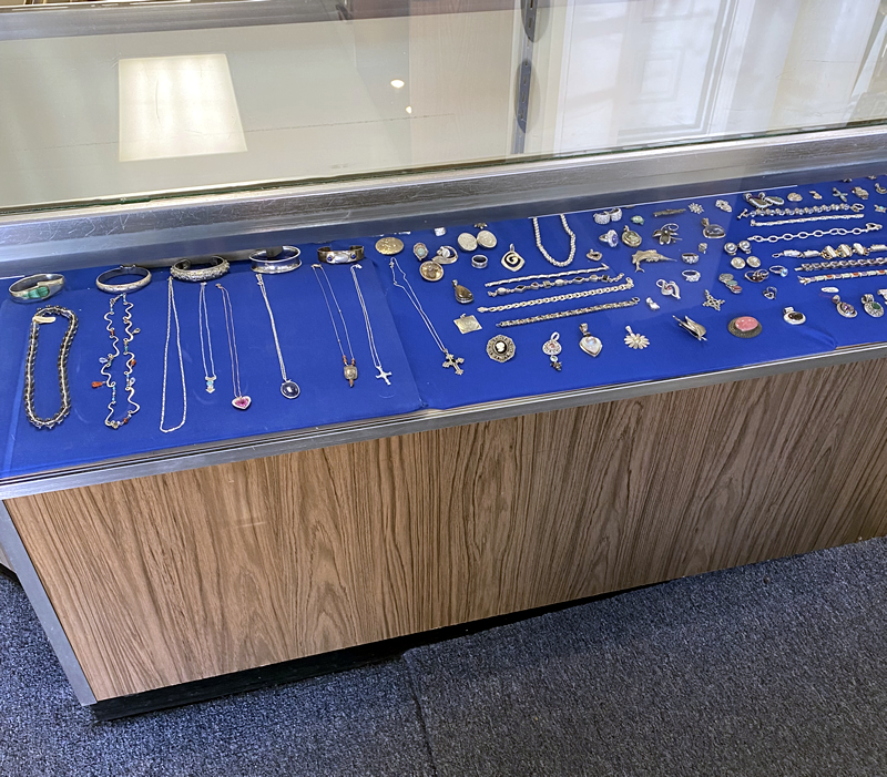 Store display cases featuring jewelry and collectibles