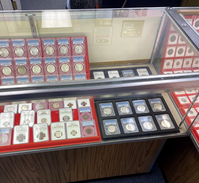 Coin display cases with red felt lining