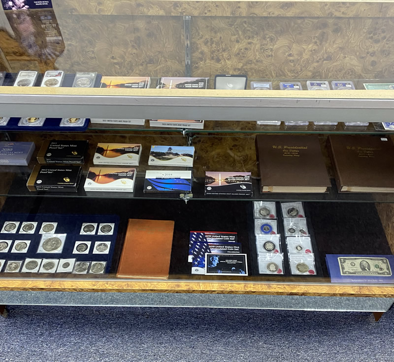 Graded coin slabs displayed in case